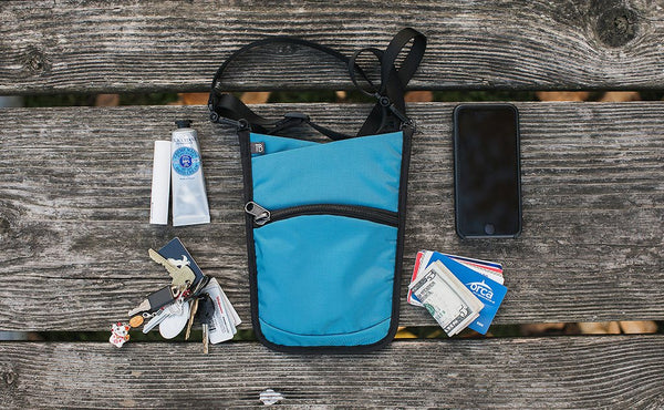 A sample loadout fro the P.I.K.A Pouch (a phone, some cards and cash, a set of keys, chapstick and a tube of lotion).